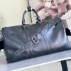 Louis Vuitton M13992 This Keepall Bandoulière 50 travel bag features a Monogram pattern on its canvas surface.