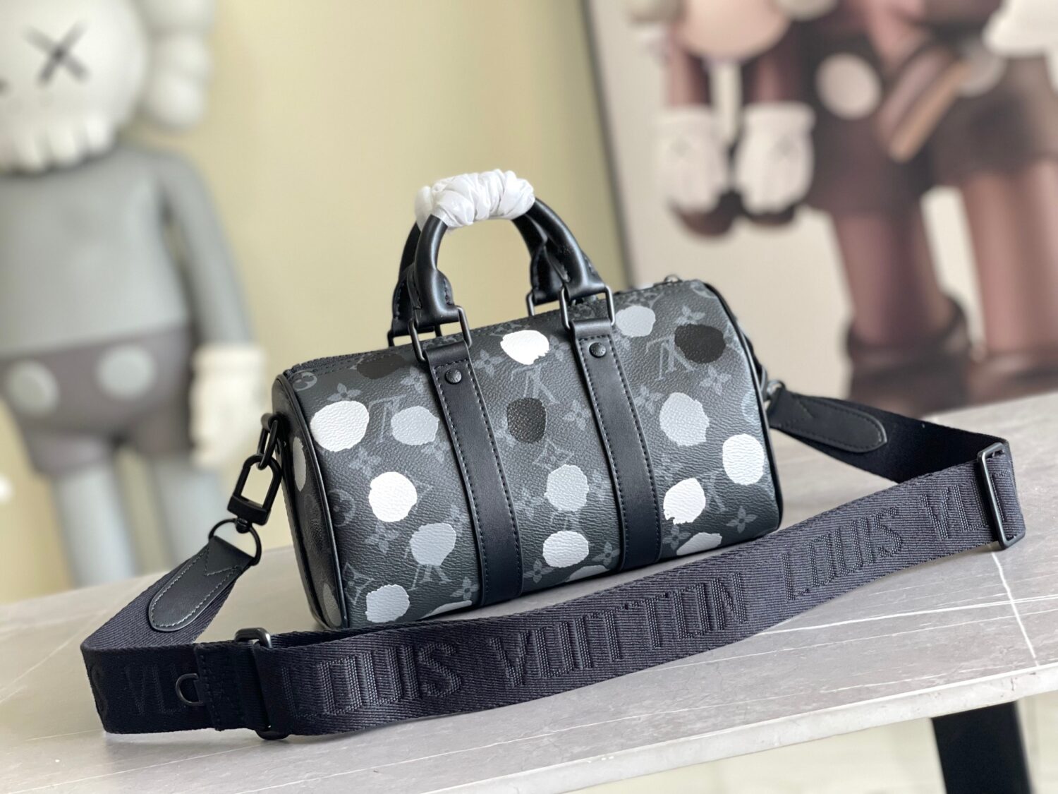 2 Louis Vuitton M46406 Black Floral Polka Dot Yayoi Kusama Handbag: This handbag encapsulates the classic silhouette of a travel bag and is crafted from embossed leather.