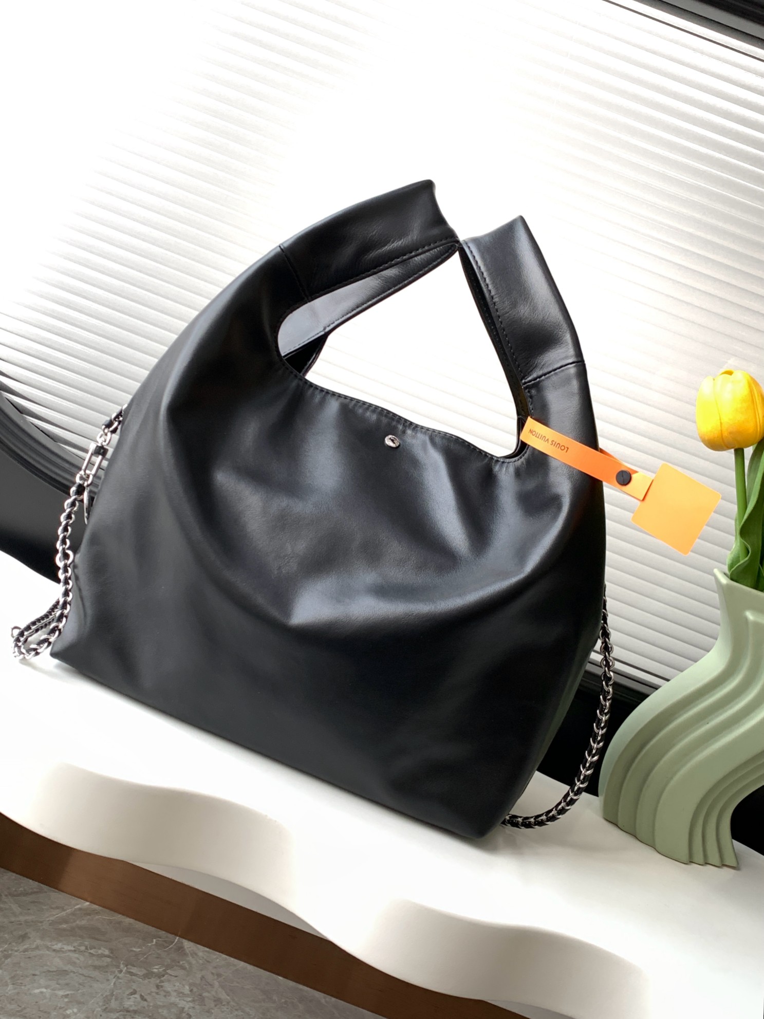 2 Louis Vuitton The M11266 Atlantis medium handbag is from the Dark Side collection.