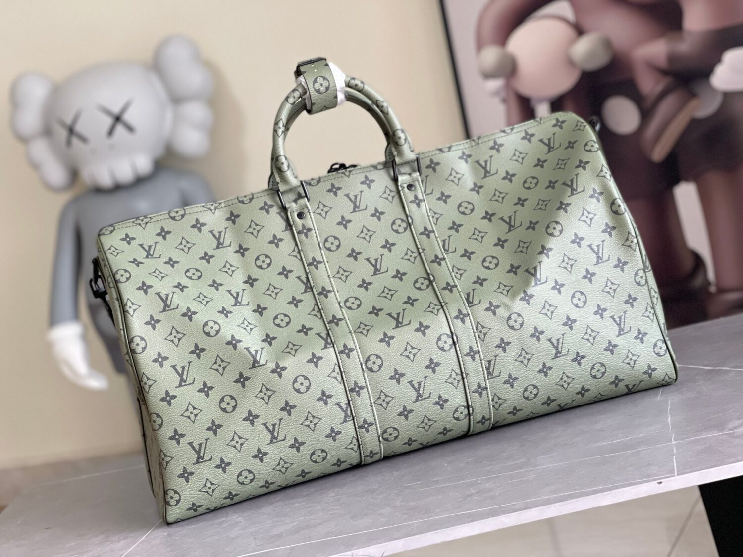 2 Louis Vuitton Keepall size 45 travel bag, style numbers 23962 and 23963, dyed in a pastel hue reminiscent of the rising sun.