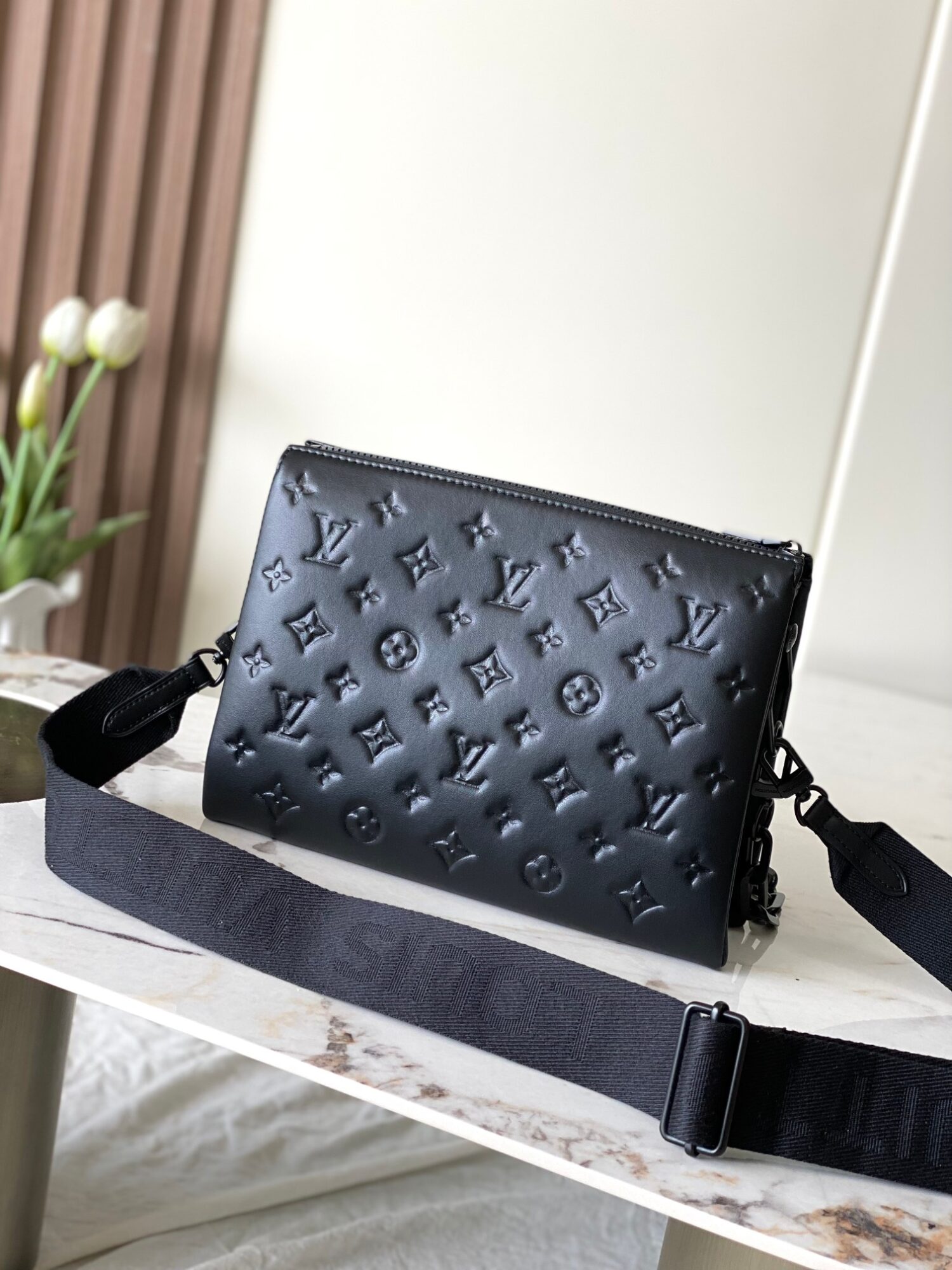 2 Louis Vuitton M11370 Black embossed leather bag with black chain.