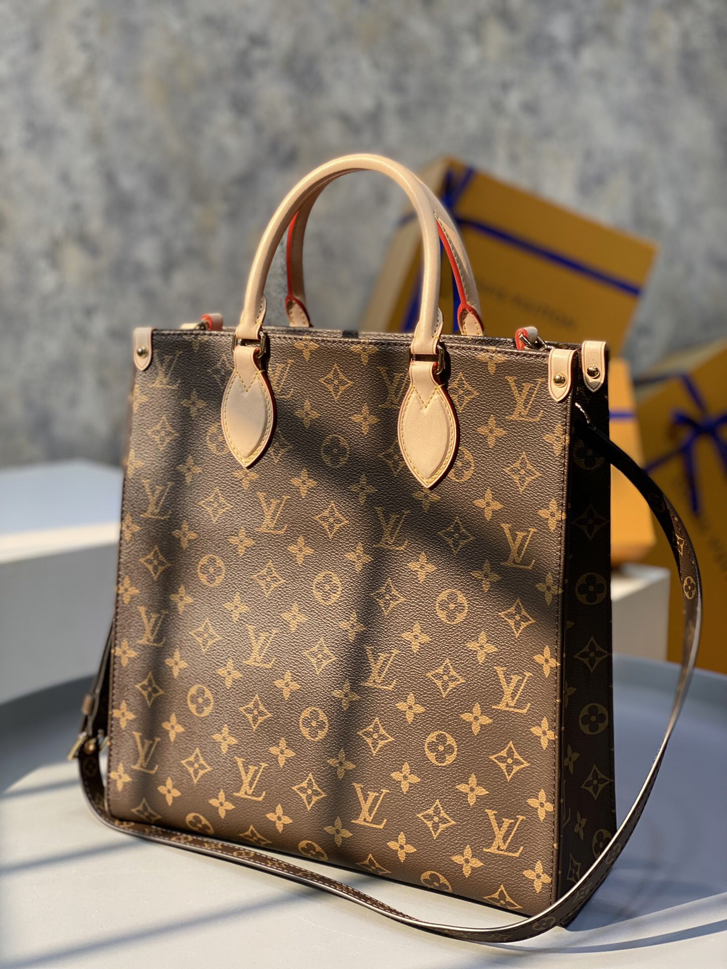 2 Louis Vuitton The M45848 classic Sac Plat medium handbag incorporates contemporary trends with its Monogram canvas and leather trim.