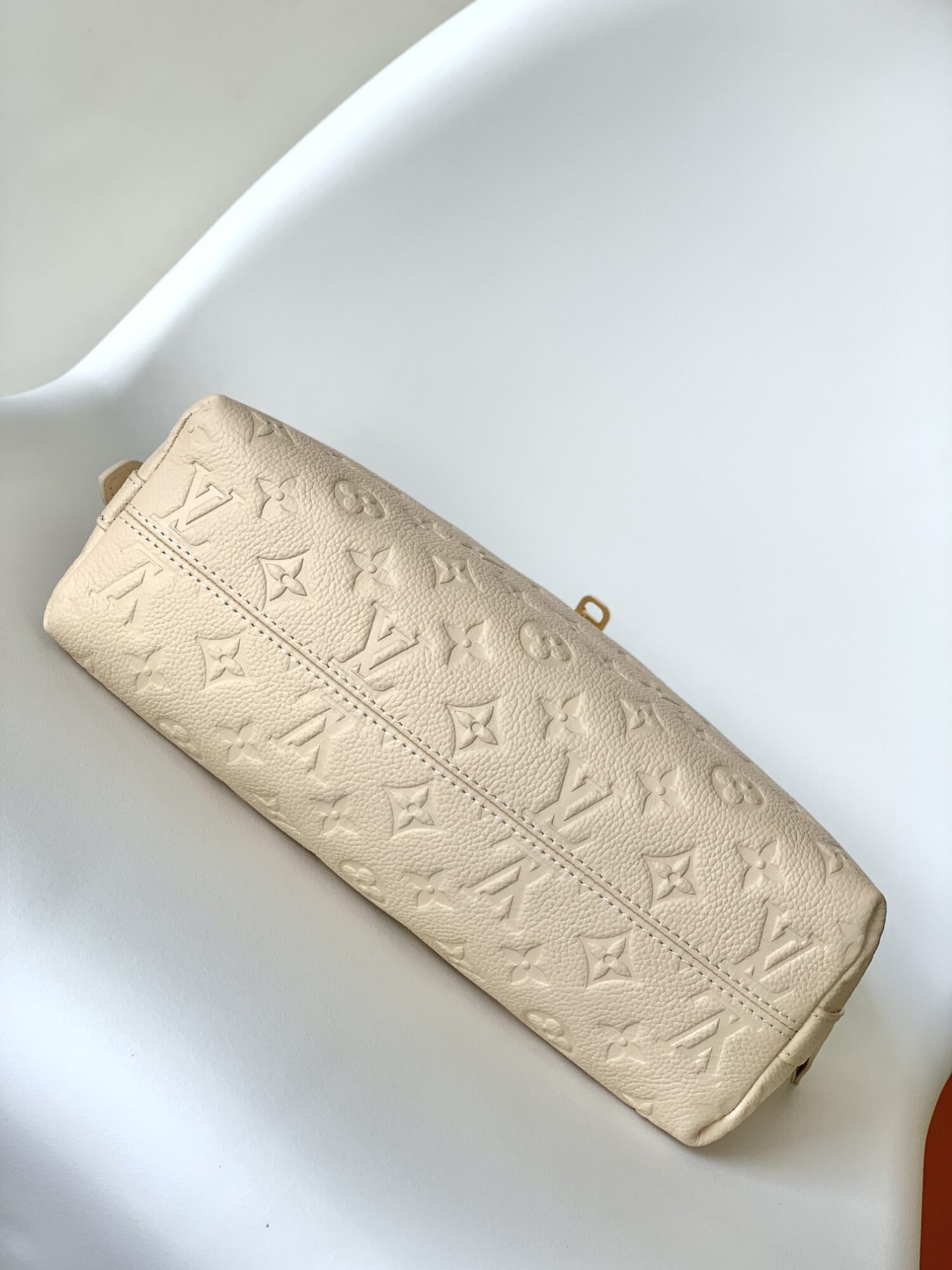 3 Louis Vuitton The Sac Sport handbag features a curved silhouette crafted from supple Monogram Empreinte embossed leather.