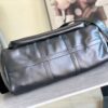 Louis Vuitton M13992 This Keepall Bandoulière 50 travel bag features a Monogram pattern on its canvas surface.