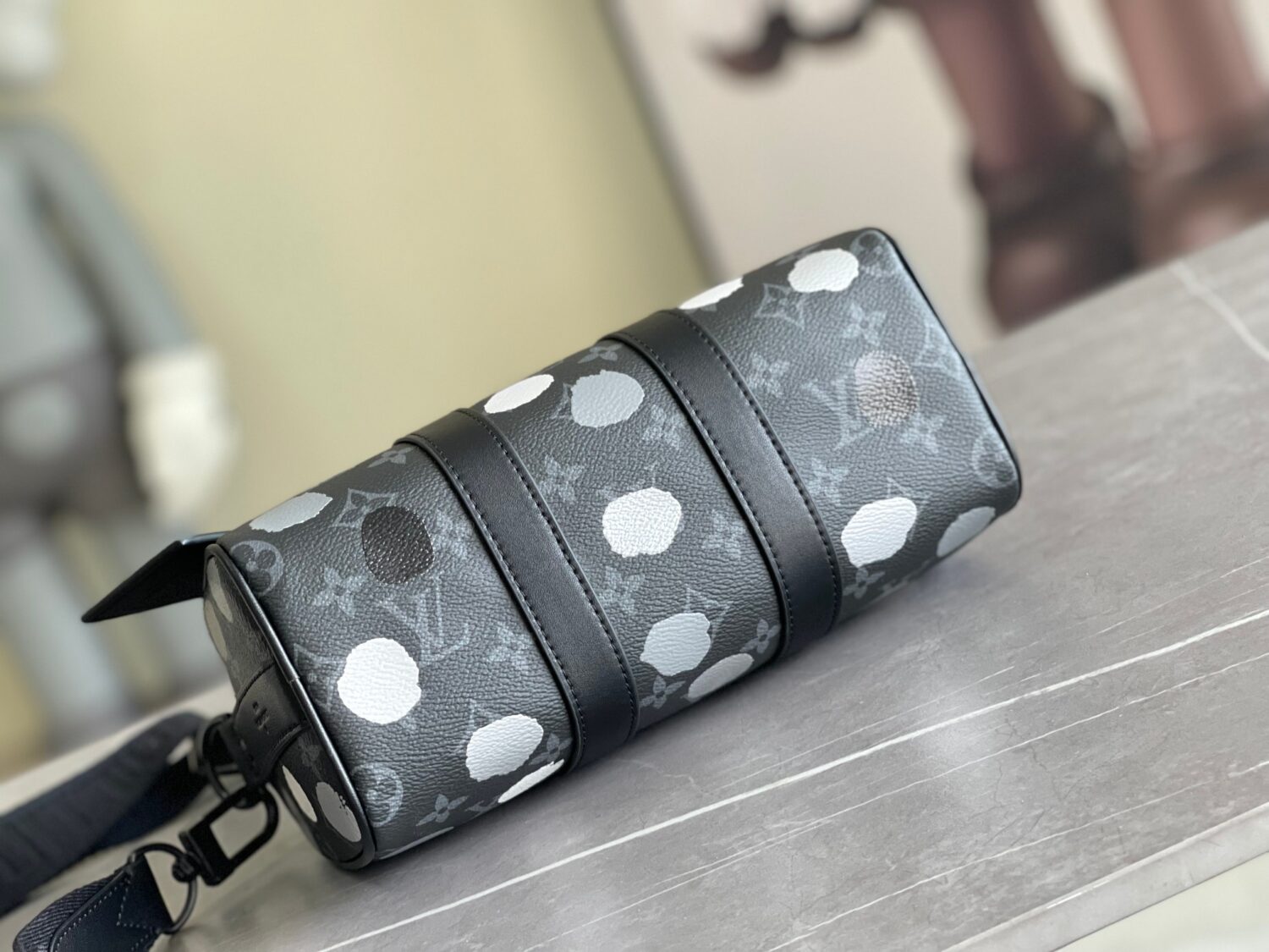 3 Louis Vuitton M46406 Black Floral Polka Dot Yayoi Kusama Handbag: This handbag encapsulates the classic silhouette of a travel bag and is crafted from embossed leather.