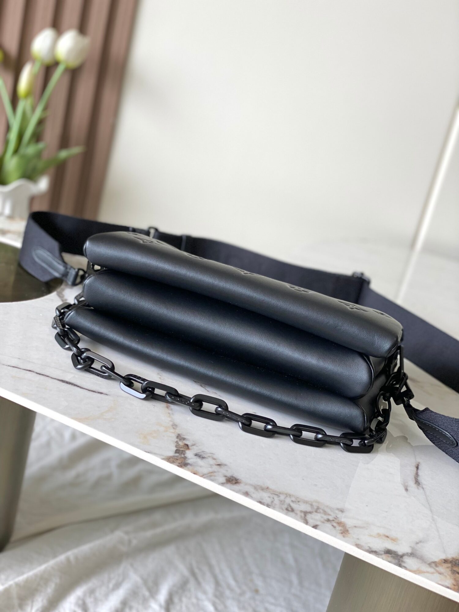 3 Louis Vuitton M11370 Black embossed leather bag with black chain.