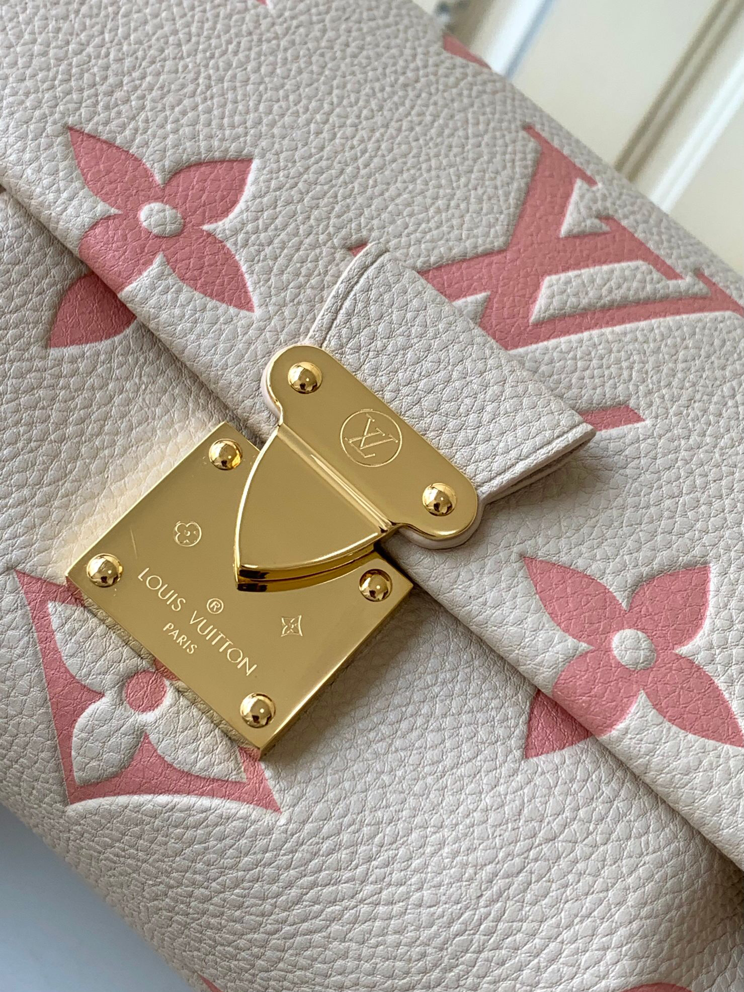 Louis Vuitton The M46393 Favorite handbag is crafted from Monogram Empreinte embossed leather.