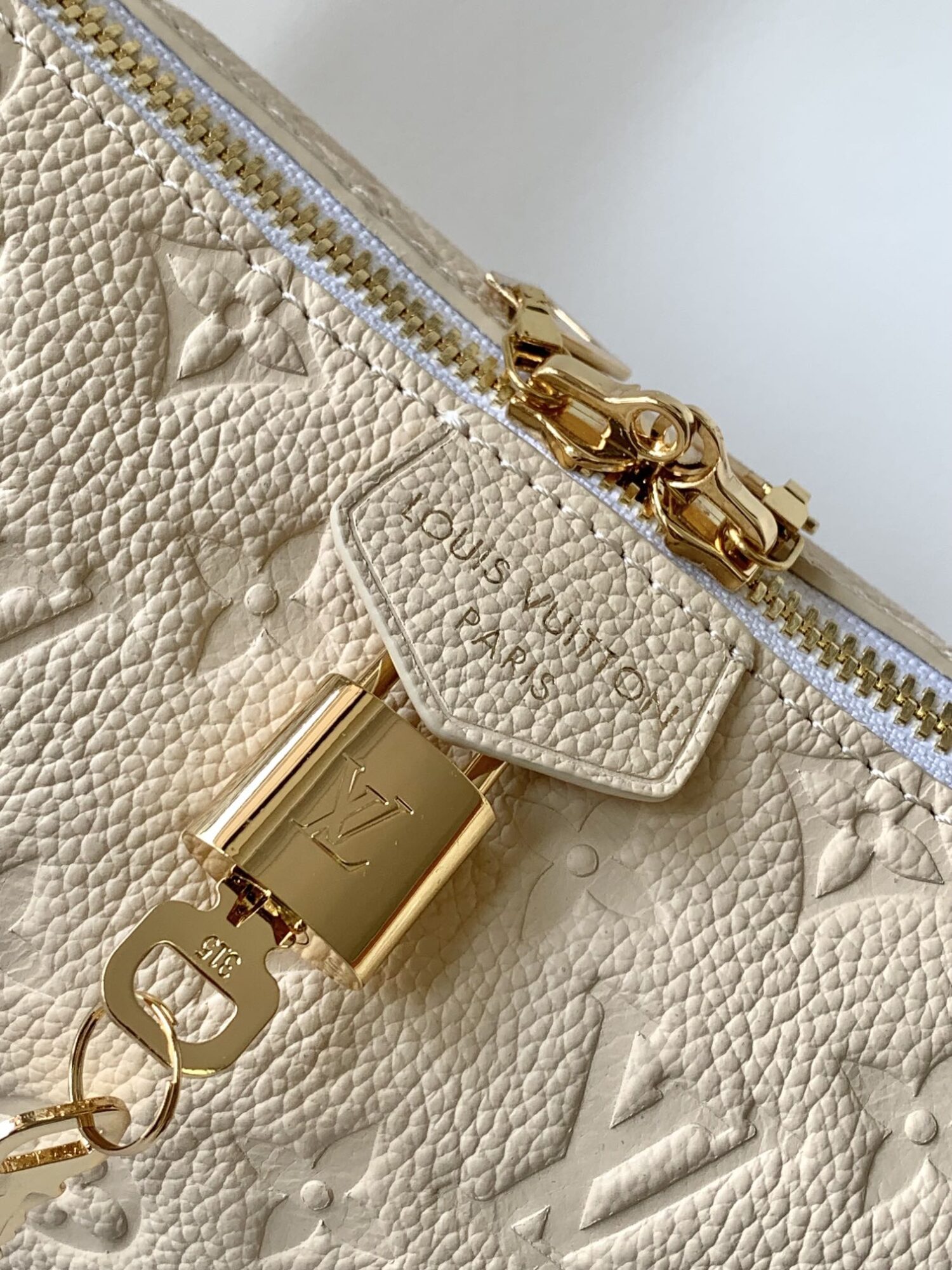 4 Louis Vuitton The Sac Sport handbag features a curved silhouette crafted from supple Monogram Empreinte embossed leather.