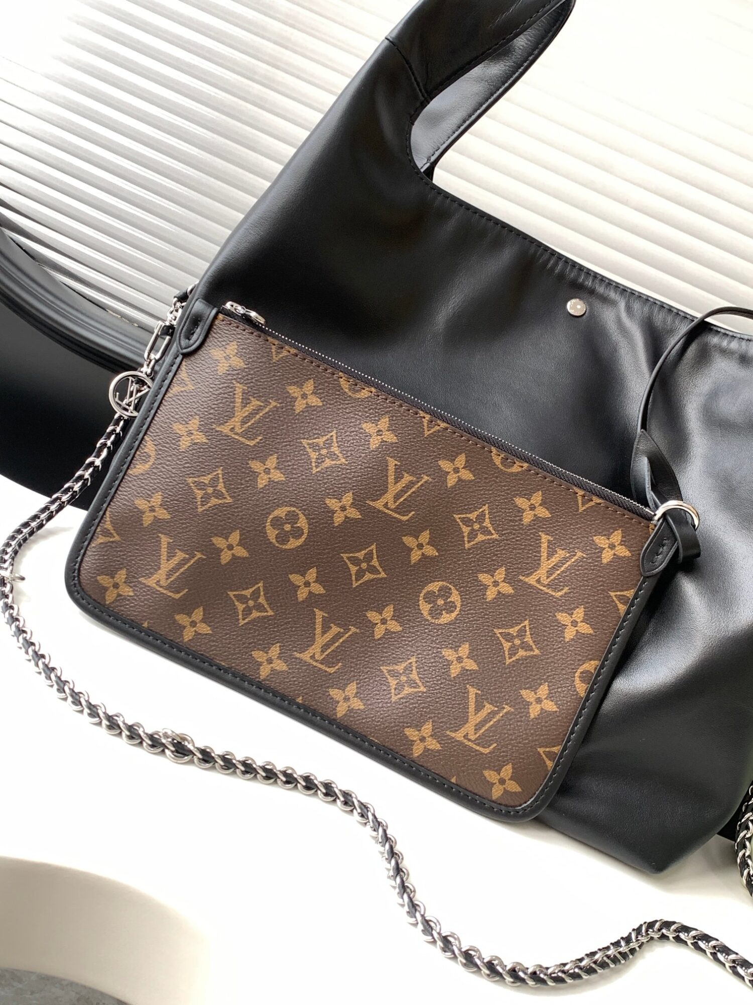 4 Louis Vuitton The M11266 Atlantis medium handbag is from the Dark Side collection.