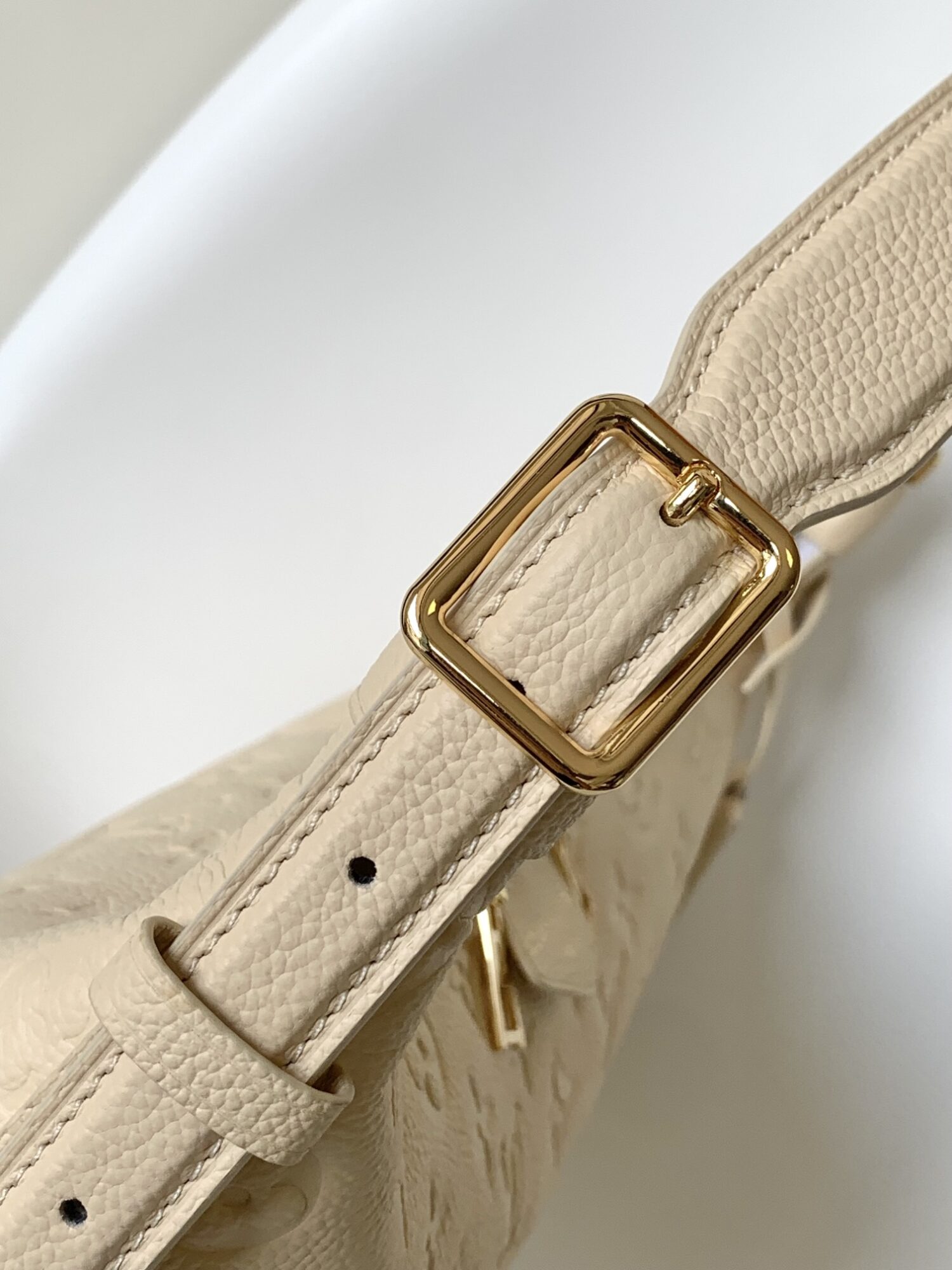 5 Louis Vuitton The Sac Sport handbag features a curved silhouette crafted from supple Monogram Empreinte embossed leather.