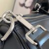 Louis Vuitton M13992 This Keepall Bandoulière 50 travel bag features a Monogram pattern on its canvas surface.