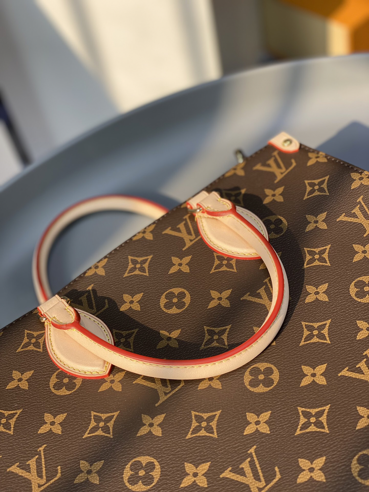 5 Louis Vuitton The M45848 classic Sac Plat medium handbag incorporates contemporary trends with its Monogram canvas and leather trim.
