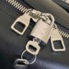 Louis Vuitton M13992 This Keepall Bandoulière 50 travel bag features a Monogram pattern on its canvas surface.