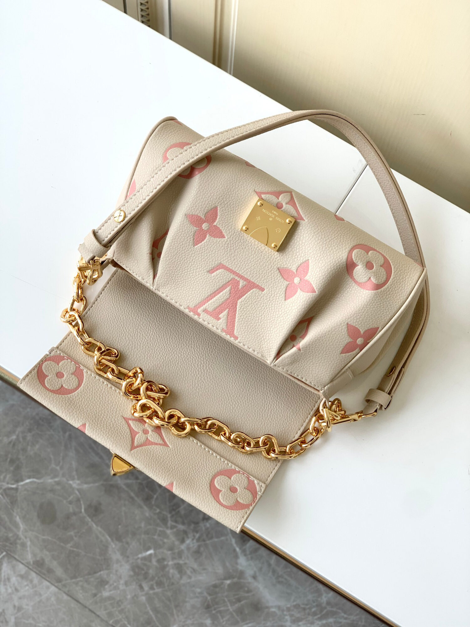 Louis Vuitton The M46393 Favorite handbag is crafted from Monogram Empreinte embossed leather.