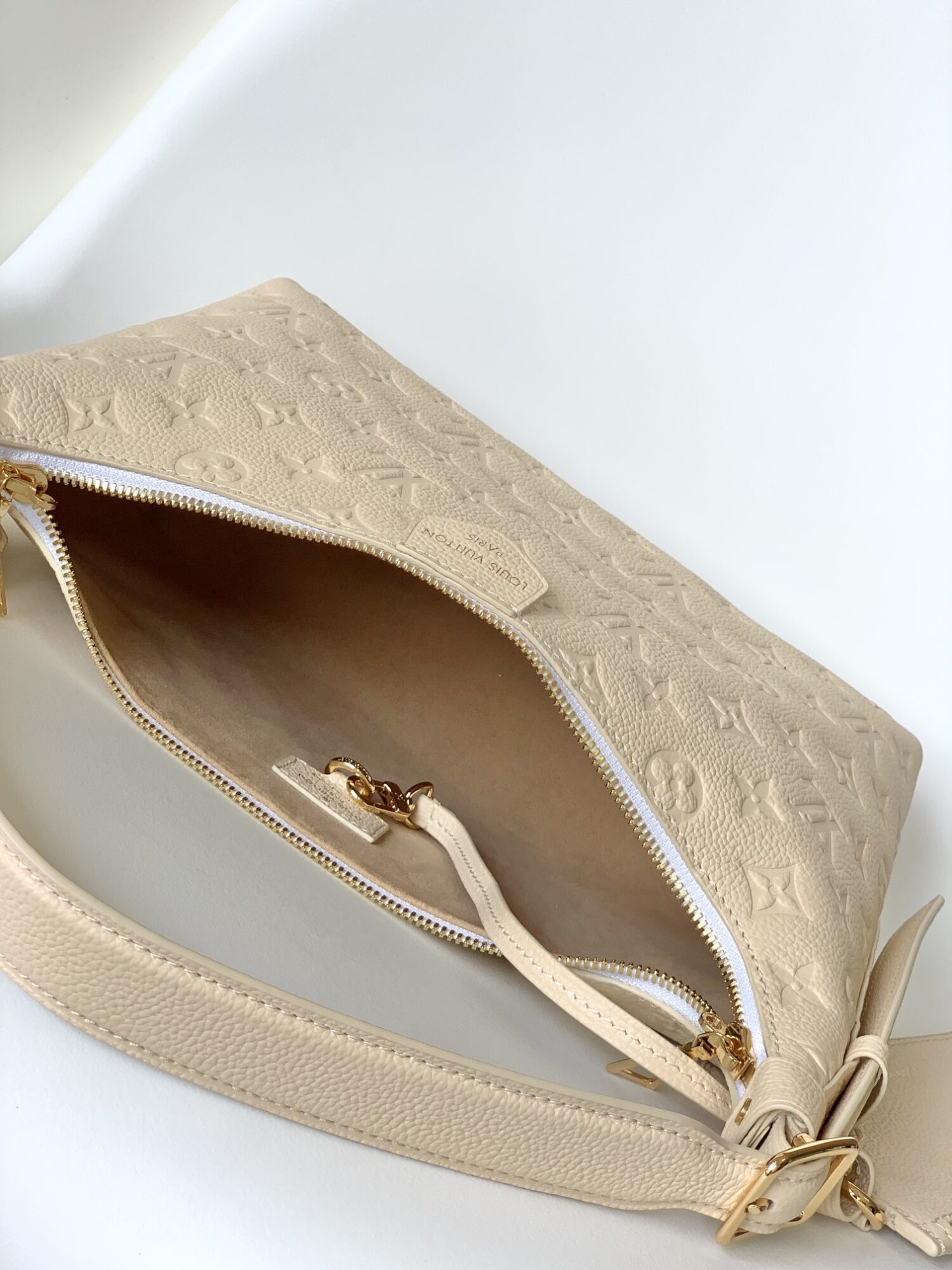 7 Louis Vuitton The Sac Sport handbag features a curved silhouette crafted from supple Monogram Empreinte embossed leather.
