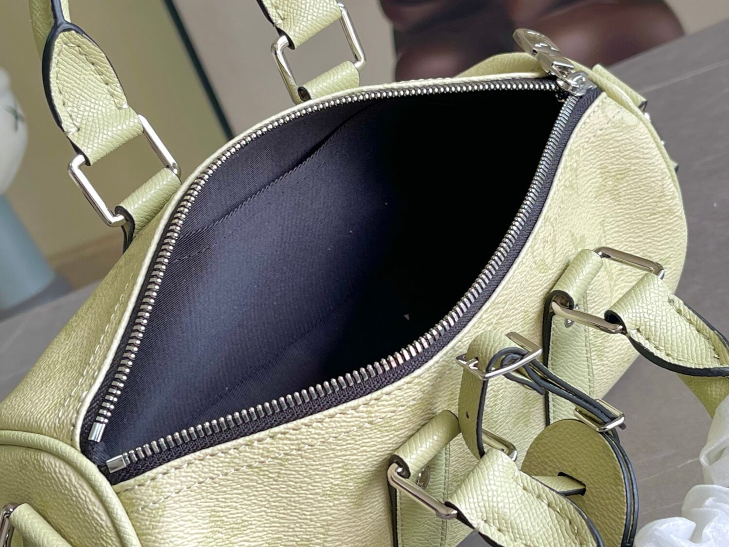 7 Louis Vuitton M14078 Light Khaki Green Pillow Bag. This Keepall 25 handbag is made of Monogram Eclipse Reverse canvas.