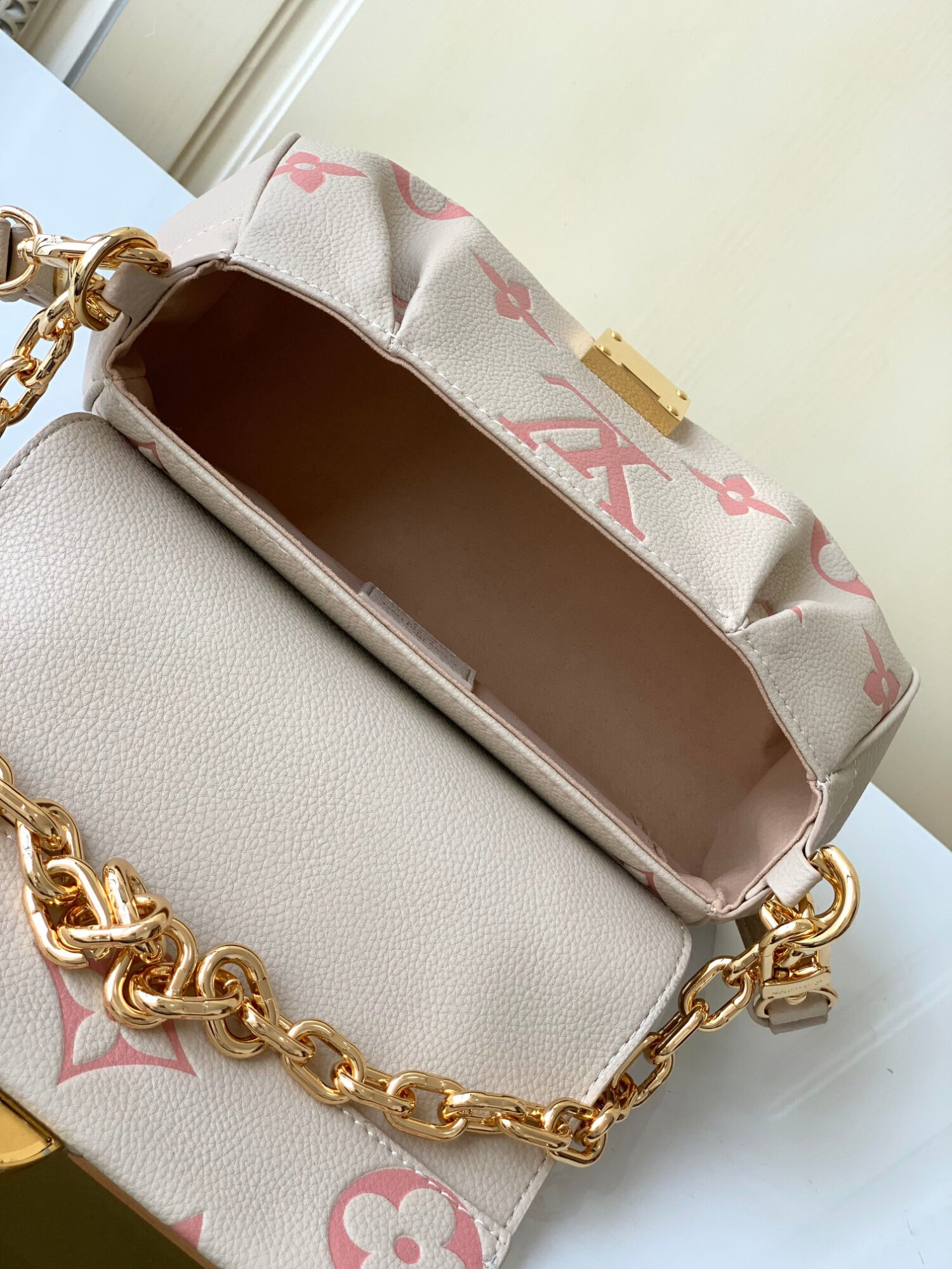Louis Vuitton The M46393 Favorite handbag is crafted from Monogram Empreinte embossed leather.