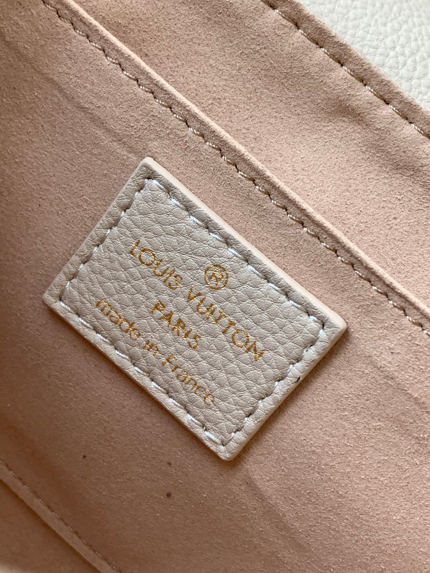 Louis Vuitton The M46393 Favorite handbag is crafted from Monogram Empreinte embossed leather.